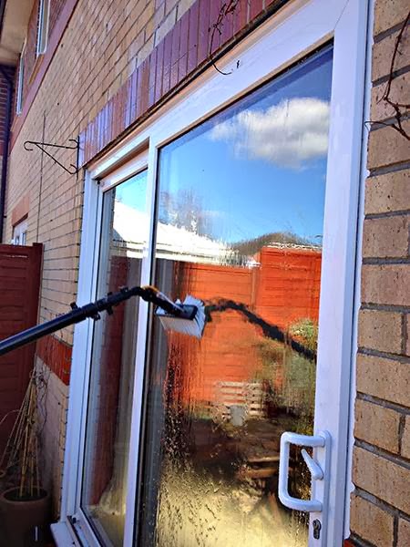 Water fed pole brush cleaning patio doors