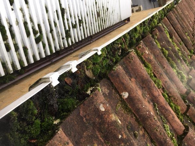 Guttering along a tiled roof